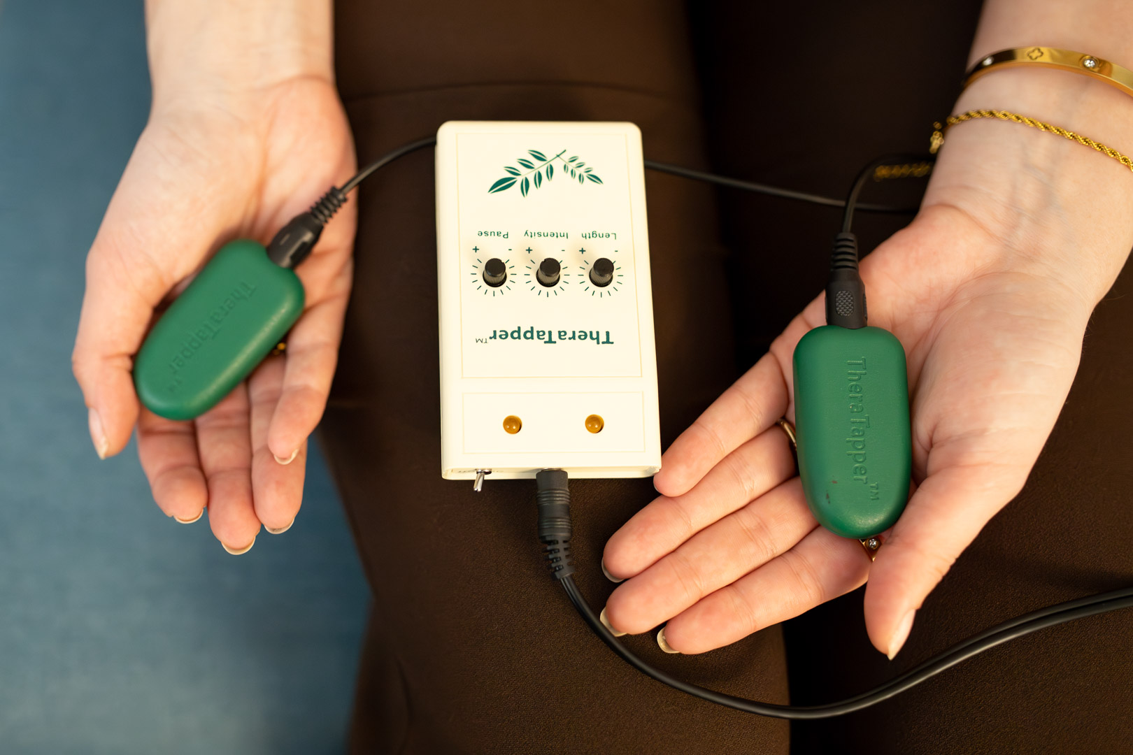 EMDR bilateral stimulation device used in trauma therapy sessions at Beyond Roots Counselling Calgary